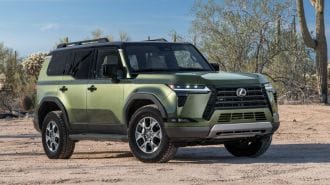2024 Lexus GX Overtrail in Nori Green with saguaro cactus in the background.