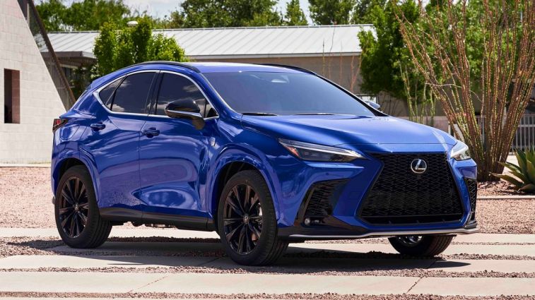 2024 Lexus NX 450h in blue parked near two buildings.