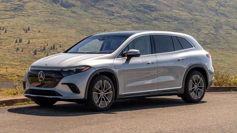 2024 Mercedes-EQ EQS SUV 450 4MATIC in silver with hills in the background.