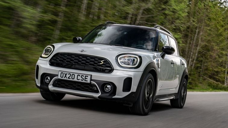 2024 Mini Countryman SE PHEV driving through a forest.