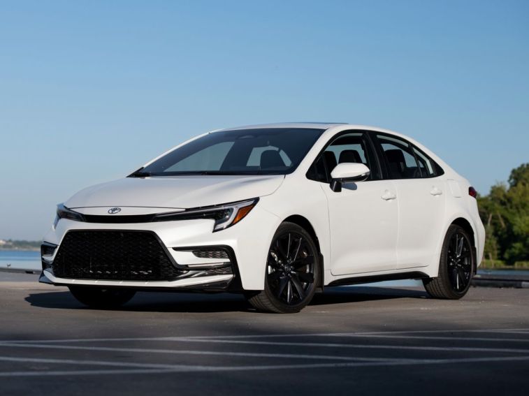 2024 Toyota Corolla XSE in Wind Chill Pearl with a lake in the background.
