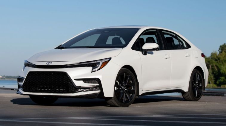 2024 Toyota Corolla XSE in Wind Chill Pearl with a lake in the background.