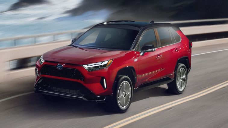 2024 Toyota RAV4 Prime XSE driving down a highway.