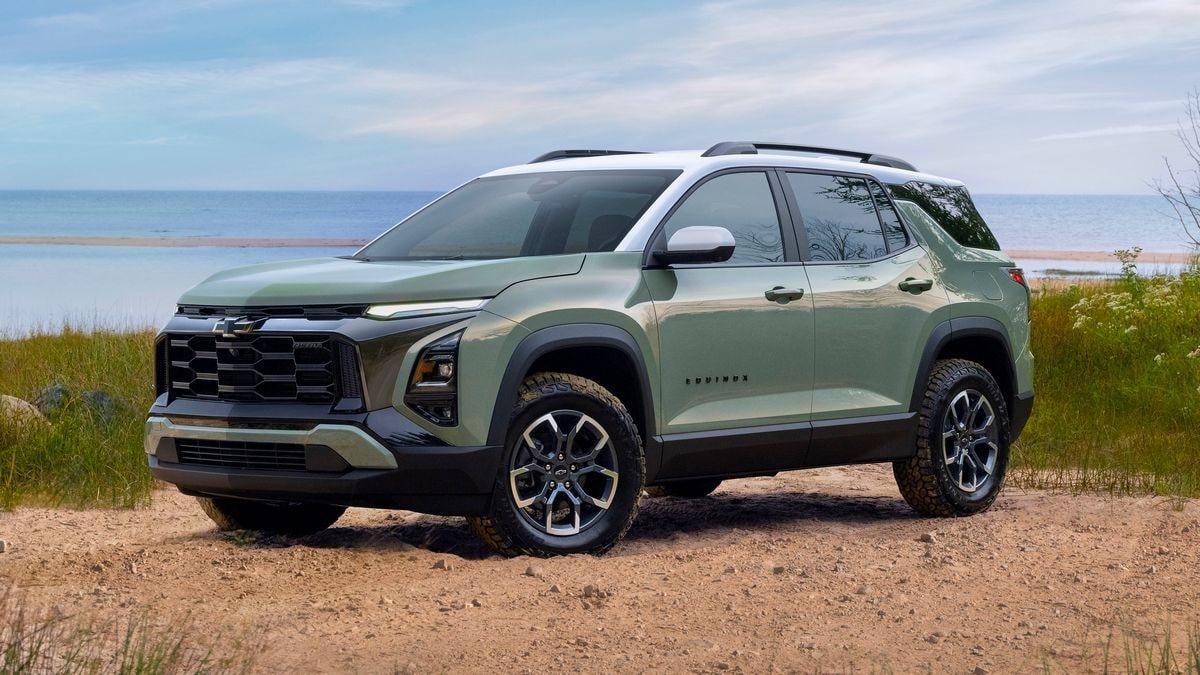 2025 Chevrolet Equinox ACTIV in Cacti Green parked in front of a lake.