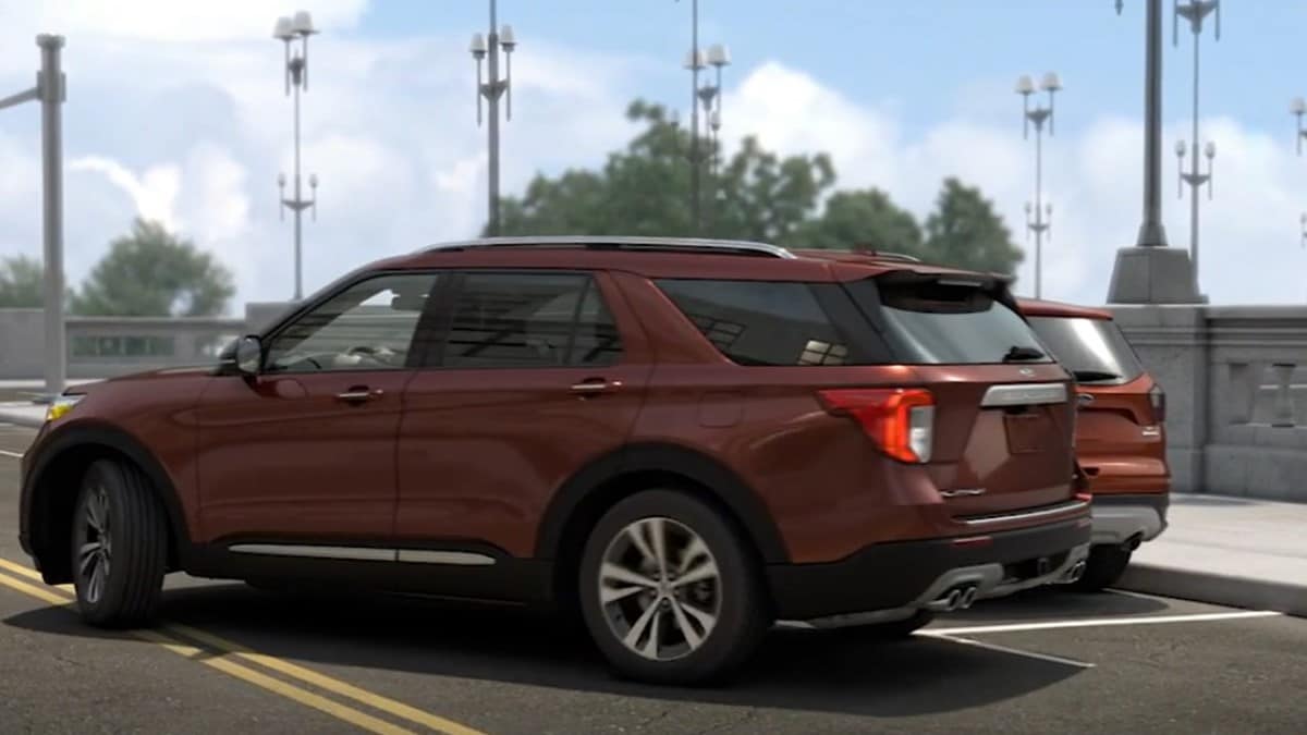 A Ford Explorer uses its automated parallel parking feature