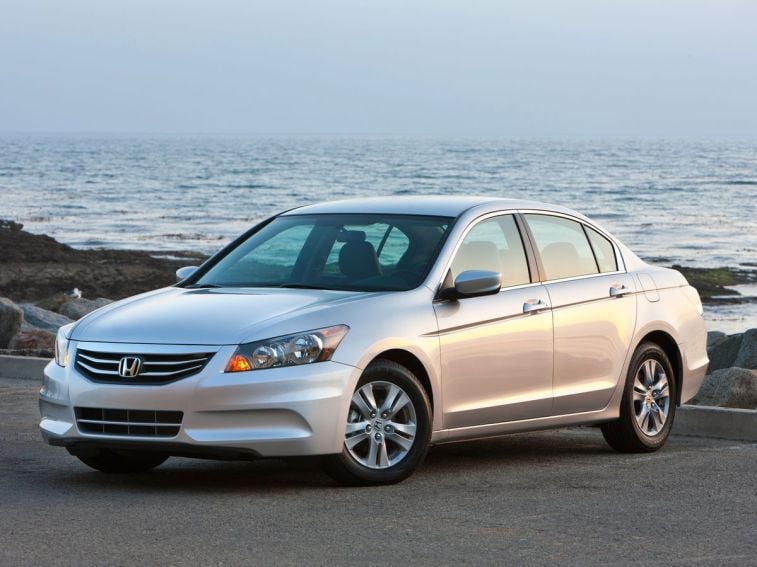 2012 Honda Accord SE Sedan in silver with the ocean in the background.