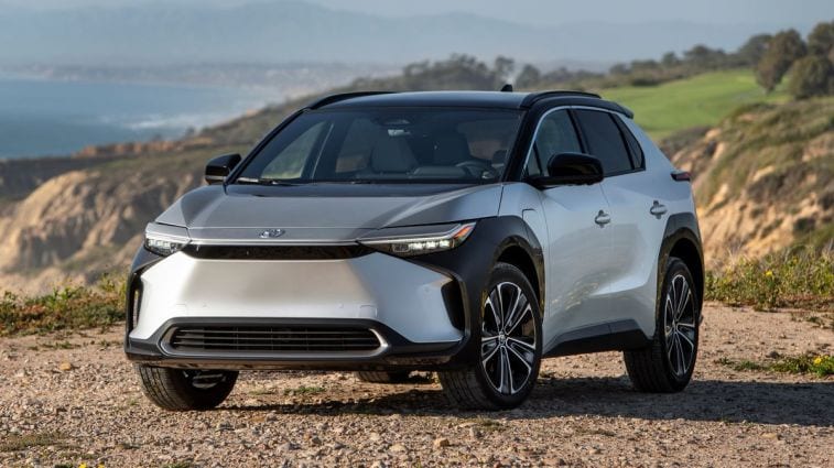 2023 Toyota bZ4X Limited in Elemental Silver Metallic overlooking the ocean.