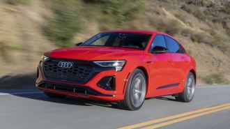 Front view of the 2024 Audi SQ8 Sportback e-tron in red driving