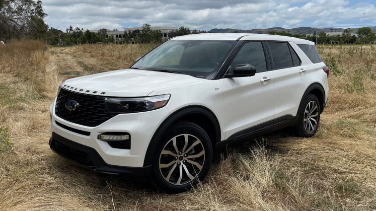 2024 Ford Explorer ST in white in a grassy field.