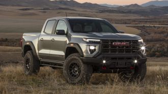 2024 GMC Canyon AT4X AEV Edition in a field.