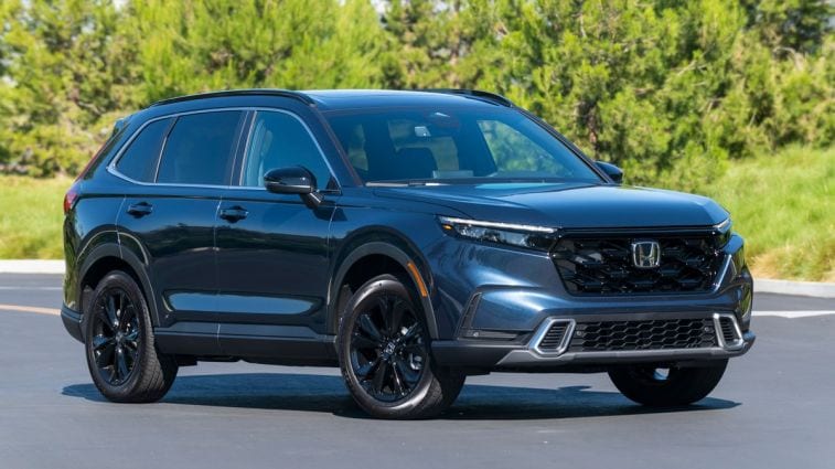 2024 Honda CR-V Hybrid with trees in the background.