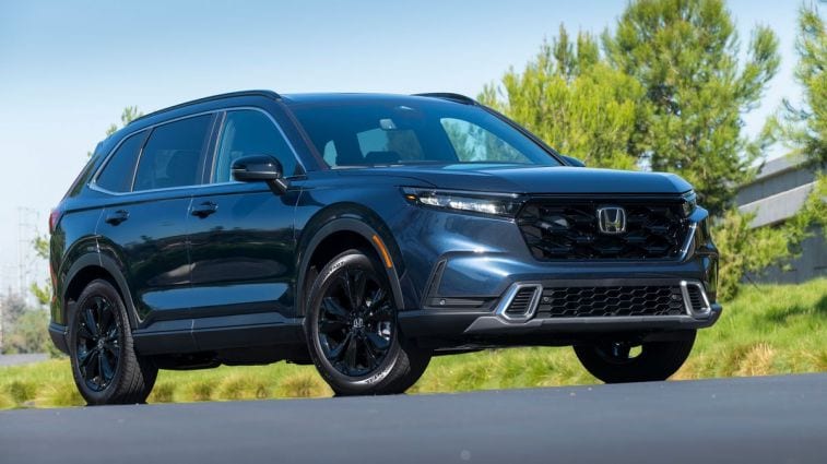 2024 Honda CR-V Hybrid with trees in the background.