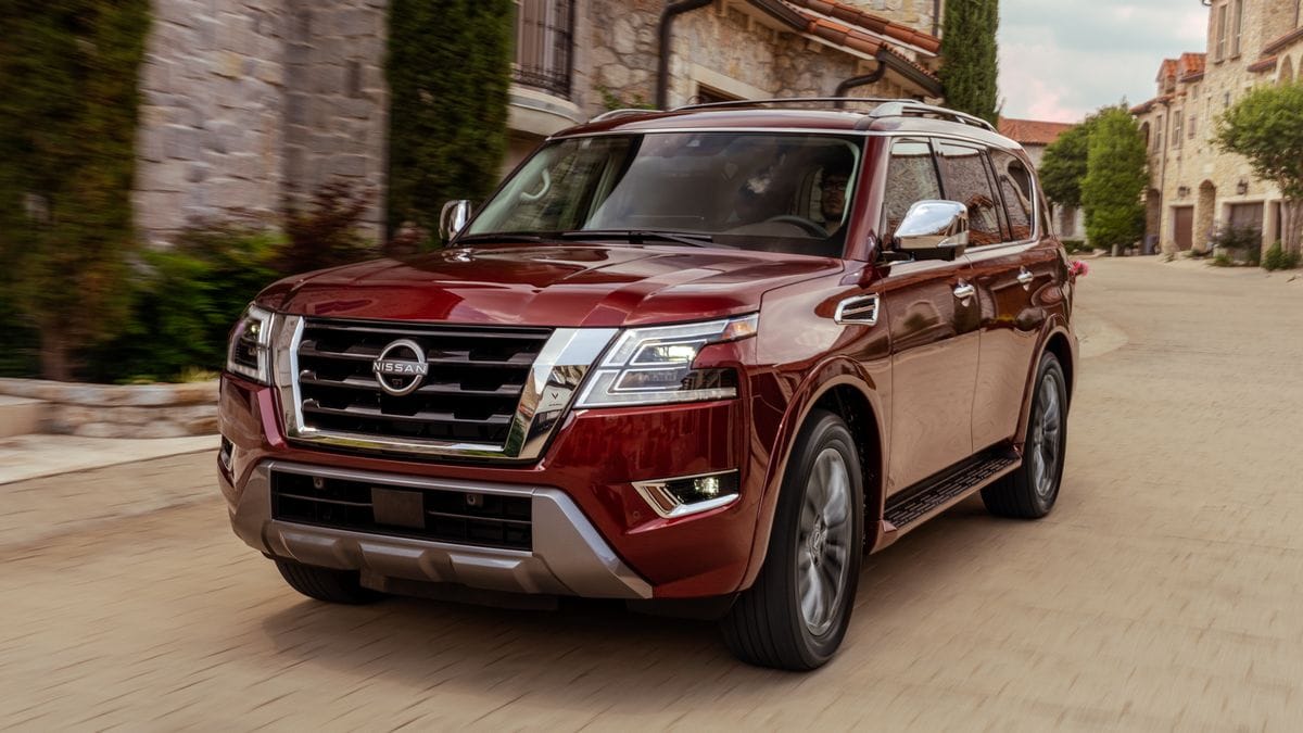 2024 Nissan Armada driving down an old street.