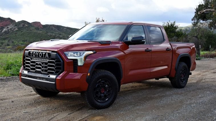 2024 Toyota Tundra TRD Pro parked on dirt with hills in the background.