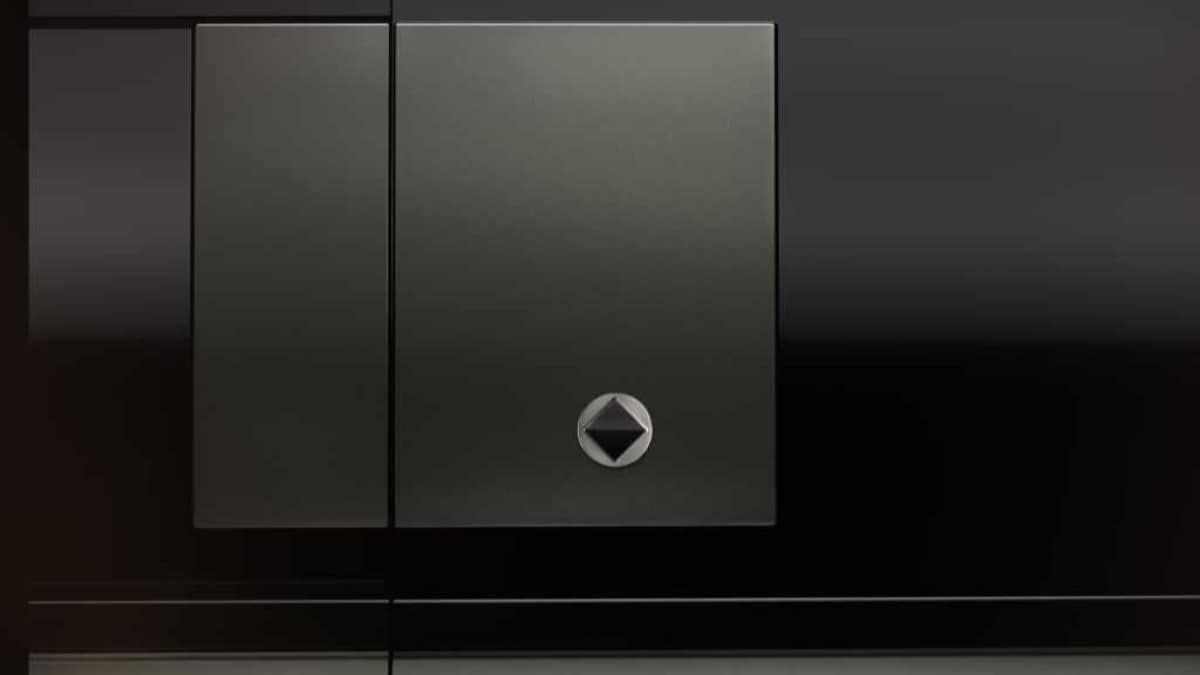 A teaser shot showing the badge of the 2025 Defender Octa