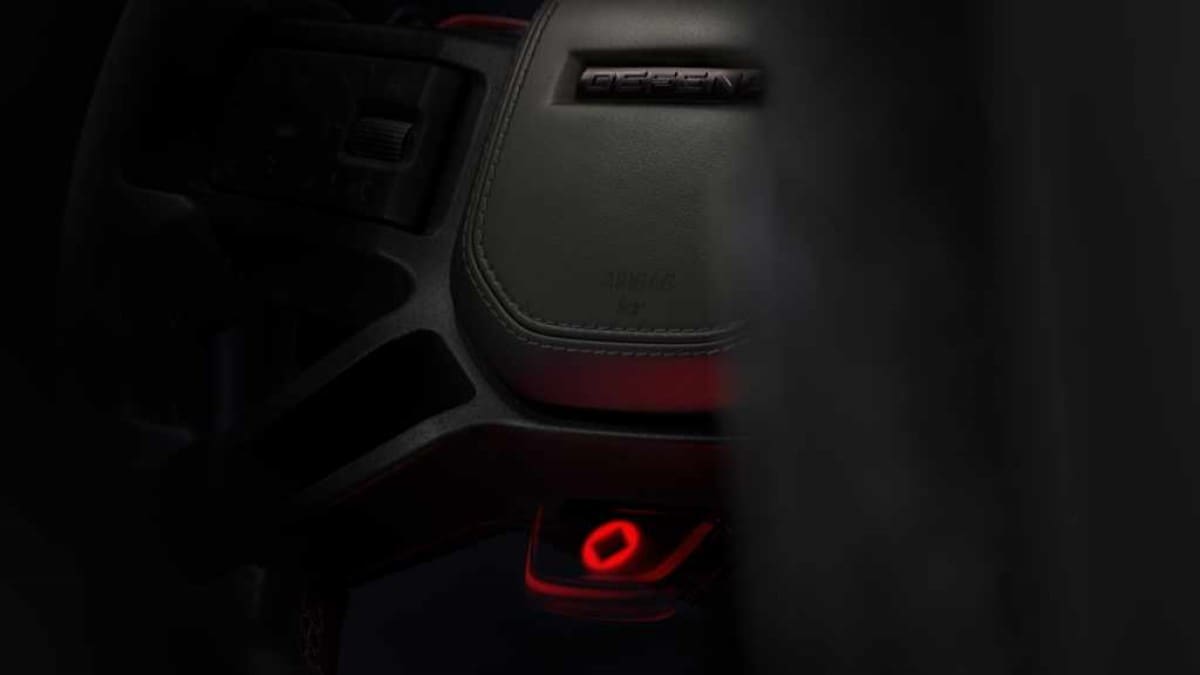 A teaser shot showing the steering wheel of the 2025 Defender Octa