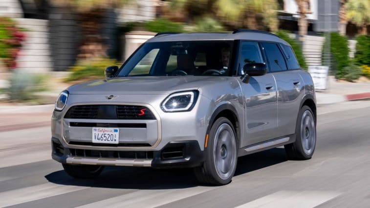 2025 Mini Countryman S ALL4 in silver driving down a street.