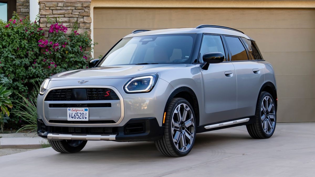 2025 Mini Countryman S ALL4 in silver parked in front of a residential garage.