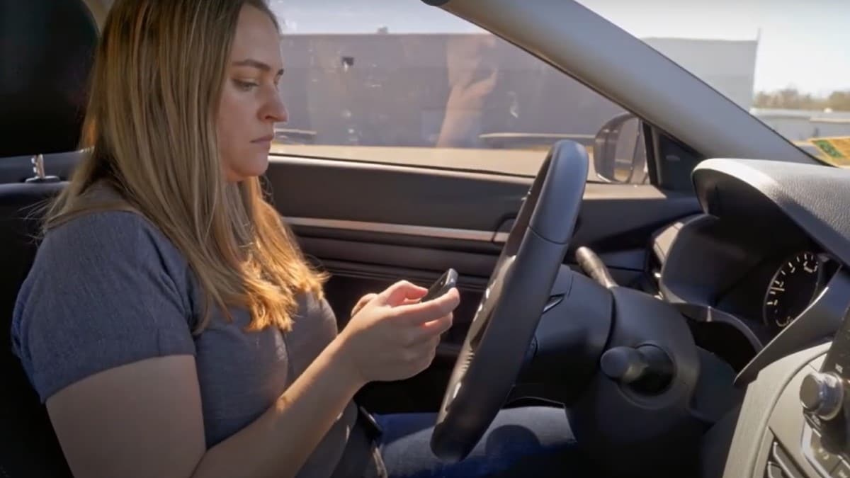 An IIHS researcher tests a driver attention monitor.