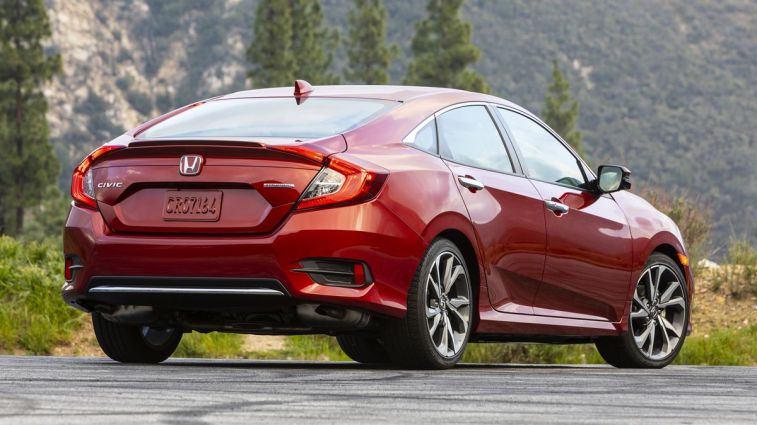 2021 Honda Civic Sedan Touring with tress in the background.
