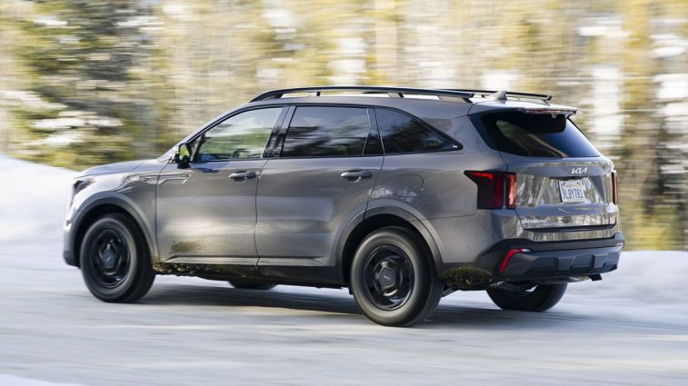 2024 Sorento SX-Prestige X-Pro driving through snow.