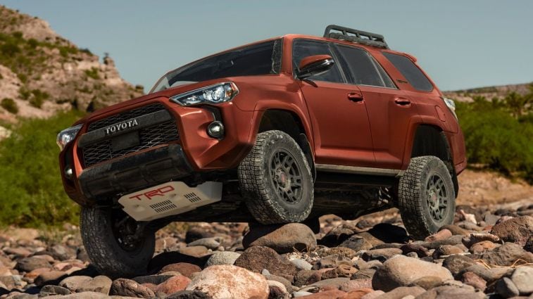 2024 Toyota 4Runner TRD Pro climbing over rocks.