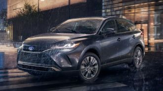 2024 Toyota Venza Limited in grey driving in the rain.