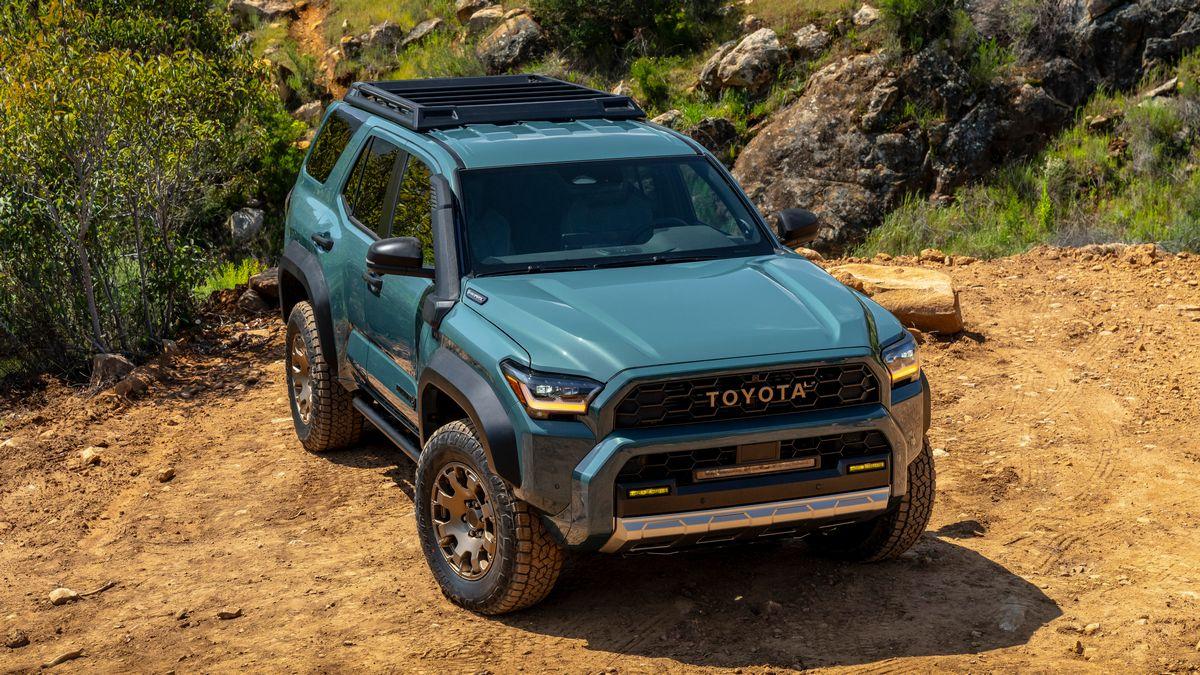 2025 Toyota 4Runner Trailhunter parked on dirt with a rocky terrain in the background.