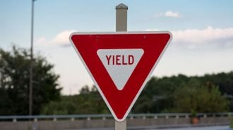 Yield sign on bridge.