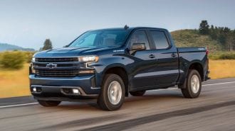 2021 Chevrolet Silverado RST driving on a highway.