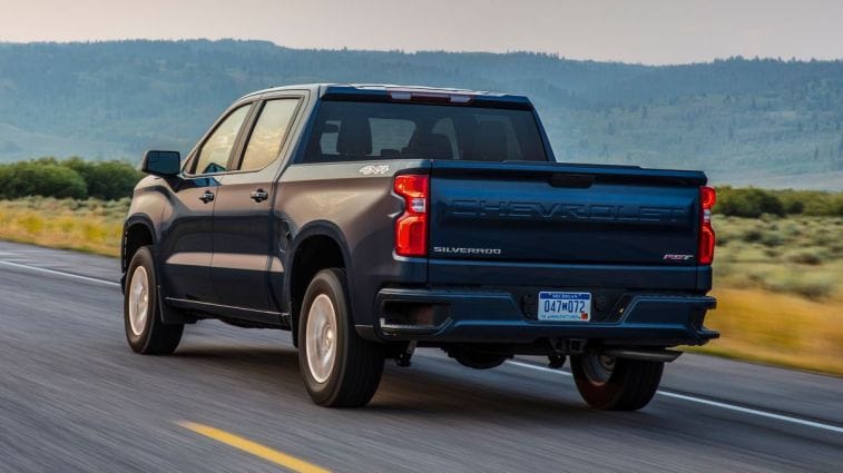 2021 Chevrolet Silverado RST driving on a highway.