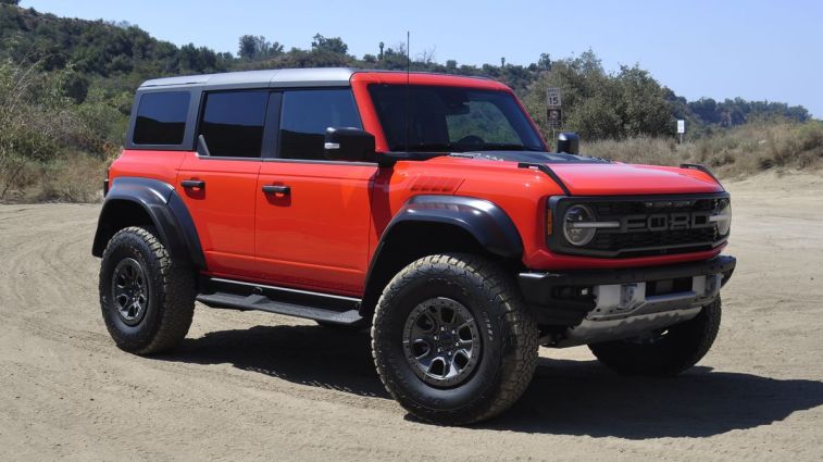 2024 Ford Bronco Raptor on a dirt road.