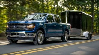 2024 Ford F-150 XLT towing a trailer.