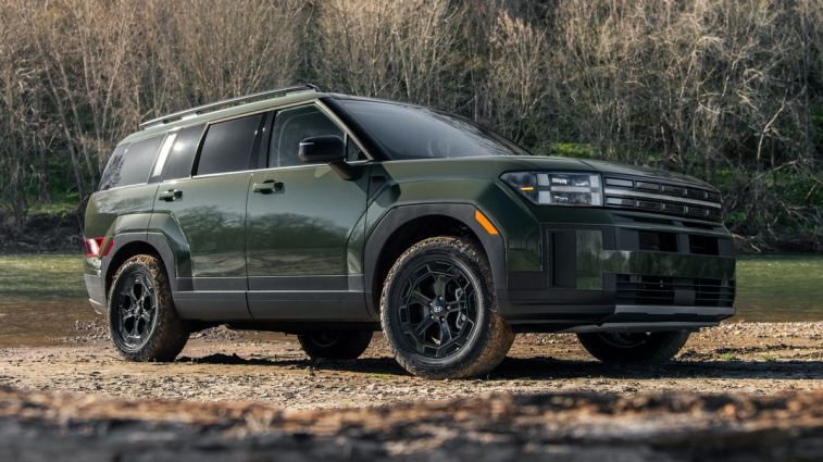 2024 Hyundai Santa Fe XRT in green parked near a stream.