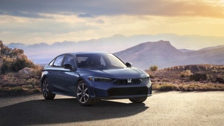 The 2025 Honda Civic Hybrid sedan seen from a front quarter angle