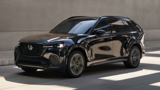 2025 Mazda CX-70 driving on a street.