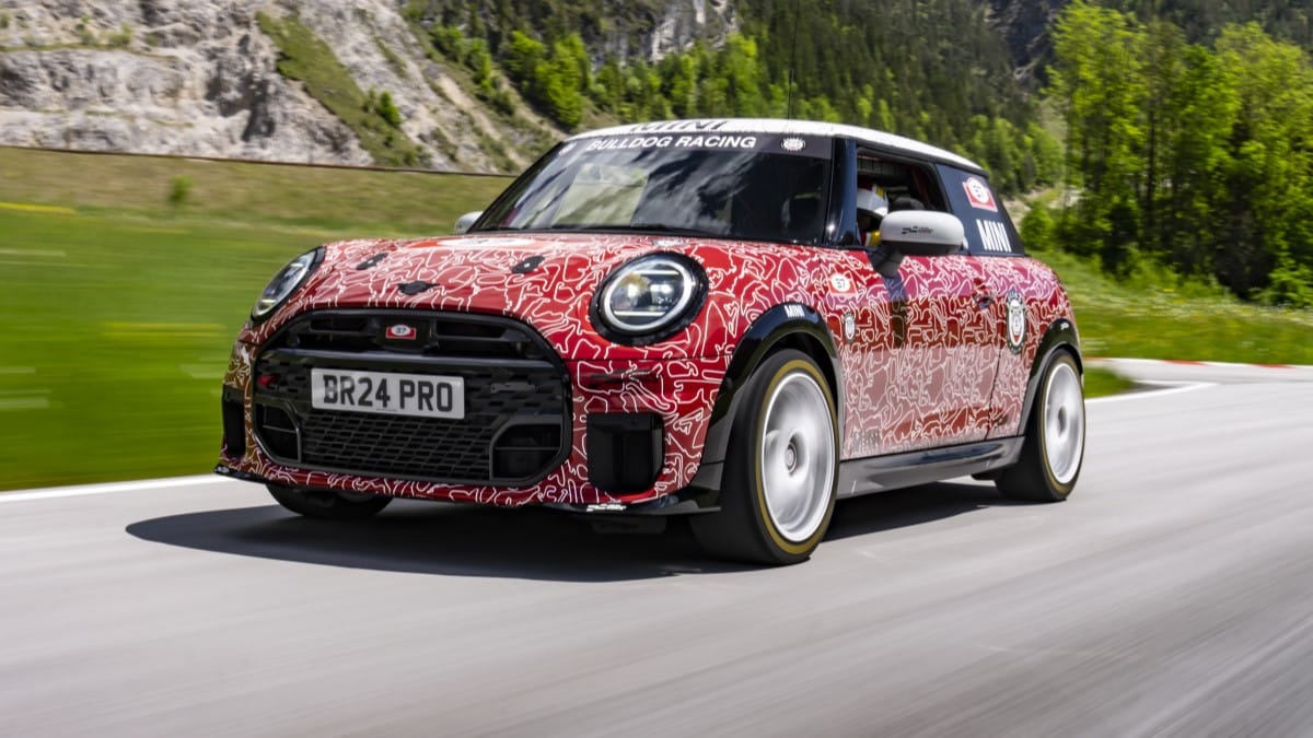 The 2025 Mini Cooper JCW in camouflage seen from a front quarter angle