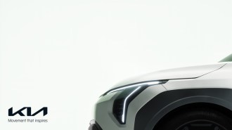 A teaser photo showing the 2026 Kia EV3's front lights