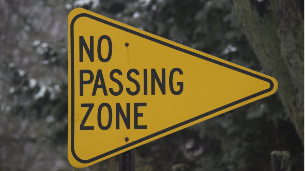 No passing zone sign along a highway