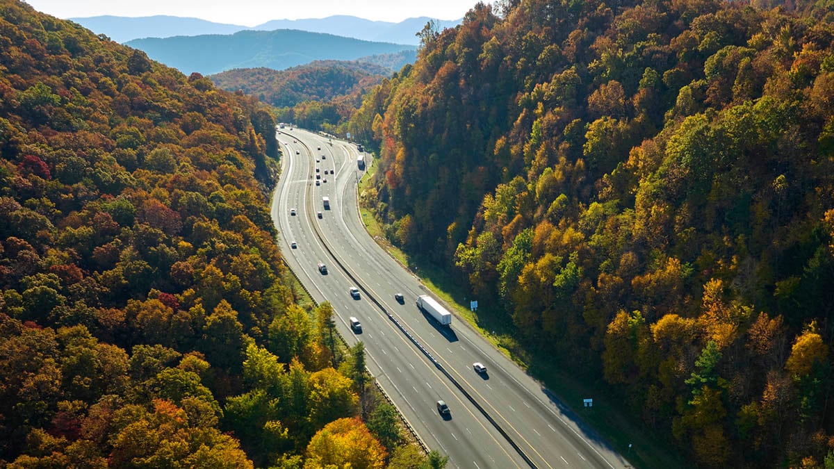 Cars driving on an interstate highway.