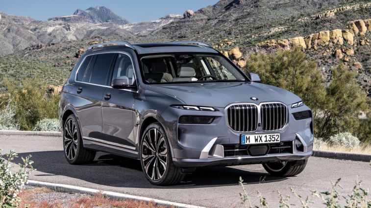 2024 BMW X7 xDrive40i with hills and rock formations in the background.