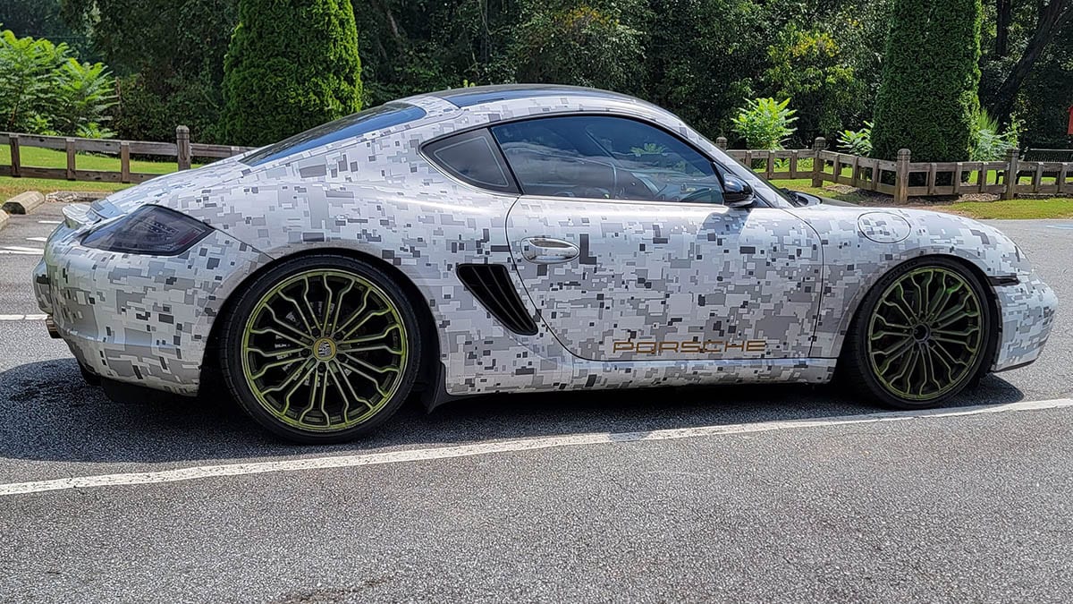 Porsche GT3 with geometric camo car wrap.