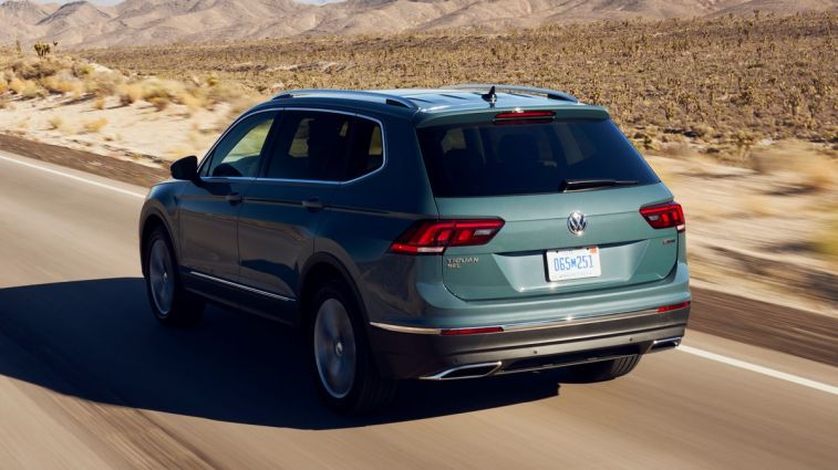 2021 Volkswagen Tiguan driving on a desert road.