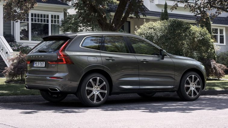 2021 Volvo XC60 Inscription in Pine Grey Metallic parked on a residential street.
