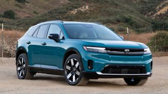 2024 Honda Prologue in North Shore Pearl with hills in the background.