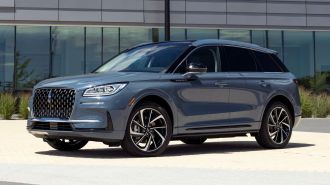2024 Lincoln Corsair Grand Touring parked in front of an office building.