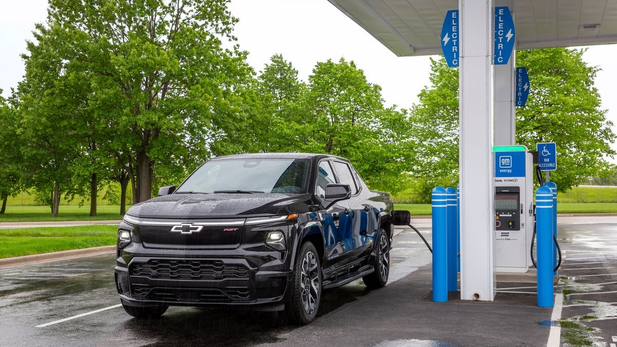 2024 Silverado EV RST charging at a GM Energy charging station.