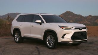 2024 Toyota Grand Highlander in white at sunrise on GMR.