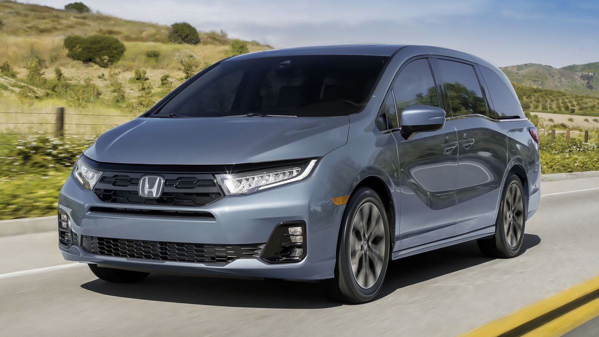 2025 Honda Odyssey in grey driving on a road.