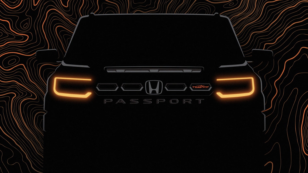 A teaser photo showing the front end of the 2026 Honda Passport, in heavy shadows